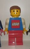 Lego Store Display Boy with Red Pants and Blue Shirt and Lego Logo