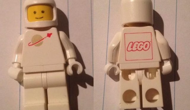 Wanted – Information or a Copy of White Lego Spaceman Minifigure with Red Lego Logo on back